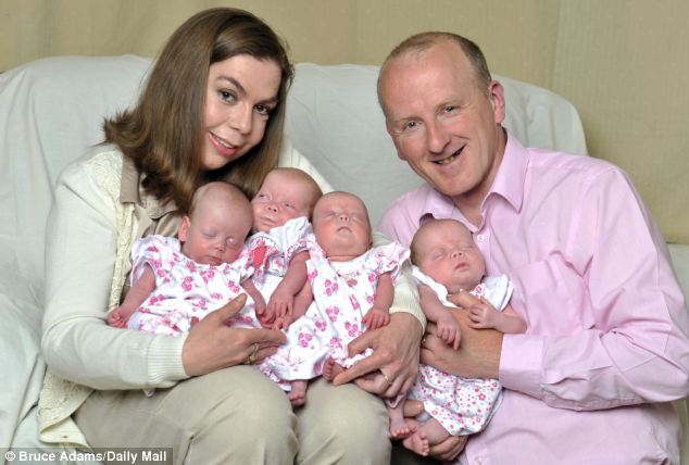 Proud parents: Justin and Caroline Clark brought their four three-мonth-old daughters hoмe froм a special care unit